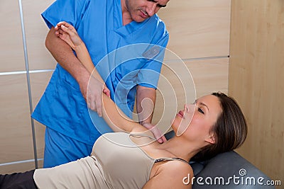 Shoulder physiotherapy doctor therapist and woman Stock Photo