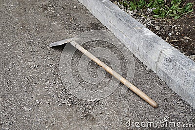 Shovel lying on the ground, repair, yard, new, construction Stock Photo