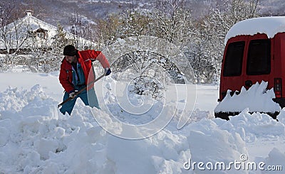 Shoveling snow in winter Editorial Stock Photo
