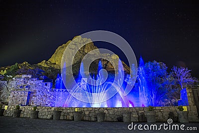 show lights and water funts PEÃ‘A DE BERNAL- is a monolith in the Queretaro state of Mexico Editorial Stock Photo