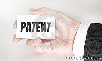 Show wait word on paper shown by business man on white background. Text PATENT Stock Photo