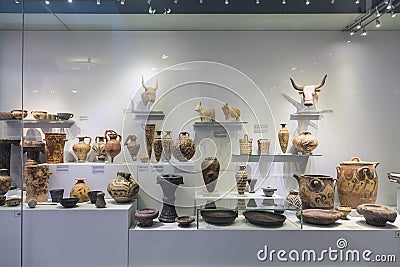 Showcase of artifacts in the Archaeological Museum in Heraklion, Crete, Editorial Stock Photo