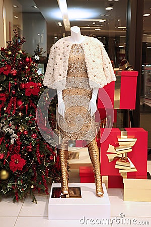 Showcase Christmas shop with mannequin expensive clothes and a C Editorial Stock Photo