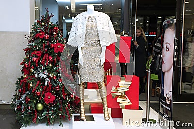 Showcase Christmas shop with mannequins, elegant expensive cloth Editorial Stock Photo