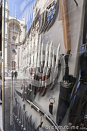 Showcase of a cutlery with a reflection of the Cathedral, Granada Stock Photo