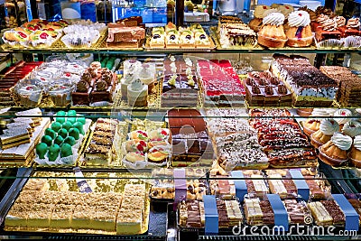 Showcase of different cakes in a confectionery shop Stock Photo