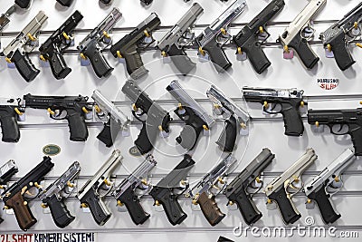 Showcase of a gun shop in Istanbul at a weapons store on the Galata Bridge. Editorial Stock Photo