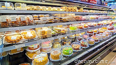 A showcase of a large supermarket with biscuit cakes. Editorial Stock Photo