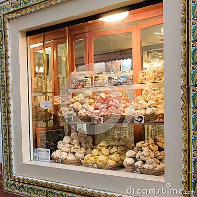 Tossa de Mar, Spain, August 2018. Showcase pastry shop on the shopping street of a small town. Editorial Stock Photo