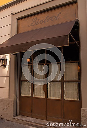 Showcase of a restaurant old style in Milan Editorial Stock Photo