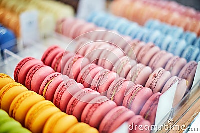 Showcase of rows of french macaroons. Close up of macaroon cookies Stock Photo