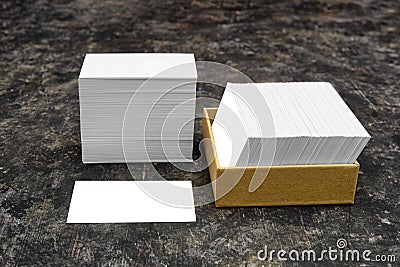 Showcasing branding design. Business card mockup. Two stacks of blank paper cards on a dark background. Stock Photo