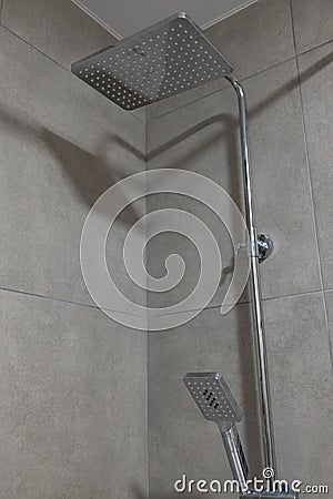 Chrome large shower head, modern design. square shower head in a modern bathroom. Stock Photo