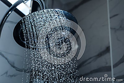 [shower head] shower head in bathroom with water drops flowing Stock Photo