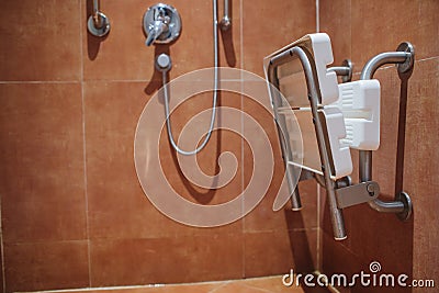 Shower with seat and grab bars for disabled and elderly people in the bathroom. Stock Photo