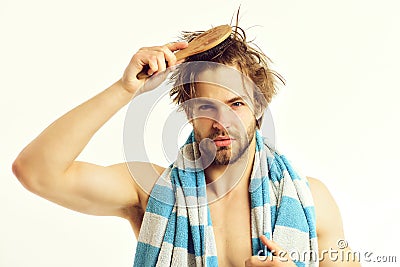 Shower time and healthy lifestyle concept. Macho with striped towel Stock Photo