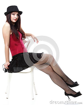 Showgirl woman dance in red corset chair white Stock Photo
