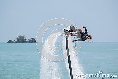 Showing flyboard on Ao Makham during Children`s day in Phuket, T Editorial Stock Photo