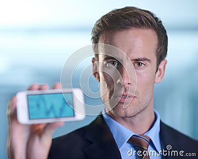 Showing you the potential for growth. A businessman showing you a graph on his smartphone. Stock Photo