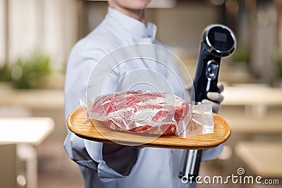 Shows cook sous vide immersion circulator cooker and the meat Stock Photo