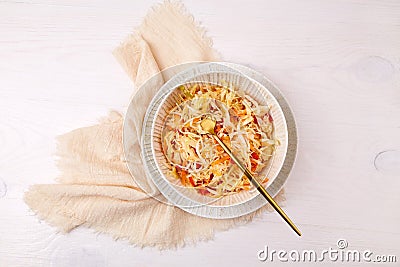 Shredded cabbage with carrots and pepper in a bowl. Pickled vegetables. Stock Photo