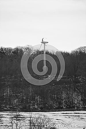 Modern windmill with destroyed broken wind blade Stock Photo