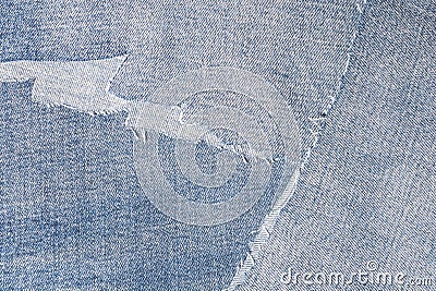 Shreds of denim fabric, unevenly cut jeans Stock Photo