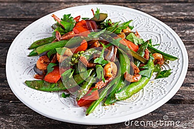 Shrimp and Asparagus stir fry food on white plate Stock Photo