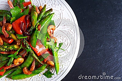 Shrimp and Asparagus stir fry food on white plate Stock Photo