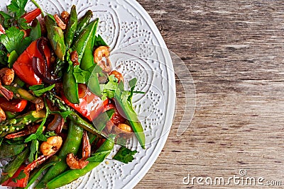 Shrimp and Asparagus stir fry food on white plate Stock Photo