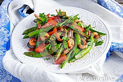 Shrimp and Asparagus stir fry food on white plate Stock Photo