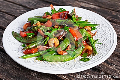 Shrimp and Asparagus stir fry food on white plate Stock Photo