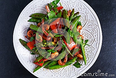 Shrimp and Asparagus stir fry food on white plate Stock Photo