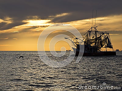 Shrimp boat leaving to Shrimp Stock Photo