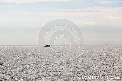 Shrimp Boat Sillouette Pulling Net Stock Photo