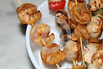 Shrimp and chicken skewer or mix kebab close and cropped view. Stock Photo