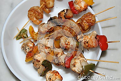 Shrimp and chicken skewer or mix kebab close and cropped view. Stock Photo