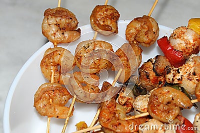 Shrimp and chicken skewer or mix kebab close and cropped view. Stock Photo