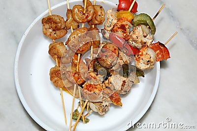 Shrimp and chicken skewer or mix kebab close and cropped view. Stock Photo