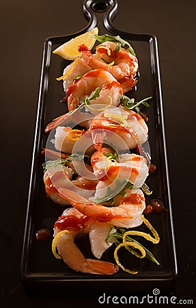 Shrimp cocktail on a black tray Stock Photo