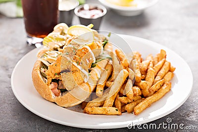 Shrimp po boy sandwich with fries Stock Photo