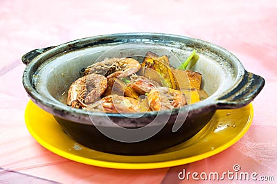 Shrimp and pumpkin pot, traditional Chinese seafood dish, served at a local Hong Kong restaurant Stock Photo