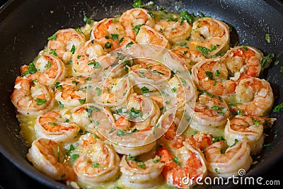 Shrimp scampi cooking in a fry pan Stock Photo