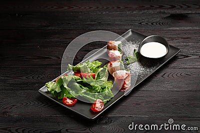 Shrimp and strawberry rolls on a plate and cream in a cup Stock Photo