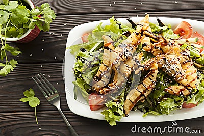 Shrimp vegetable salad in batter on a dark wooden table, oriental and asian cuisine Stock Photo