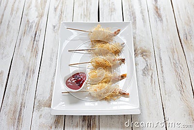 Shrimp wrapped in dough Kataifi called also Kanafeh, Kadaif. Stock Photo