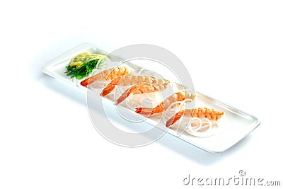 Shrimps with lemon on a rectangular plate on an isolated white background Stock Photo