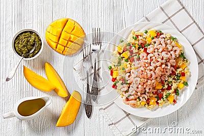 Shrimps and millet pilaf with mango and veggies Stock Photo