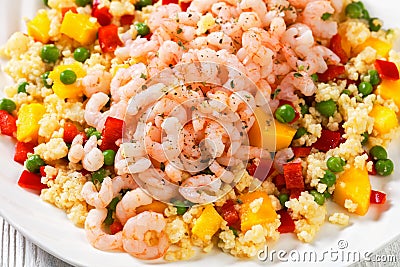 Shrimps and millet pilaf with mango and veggies Stock Photo