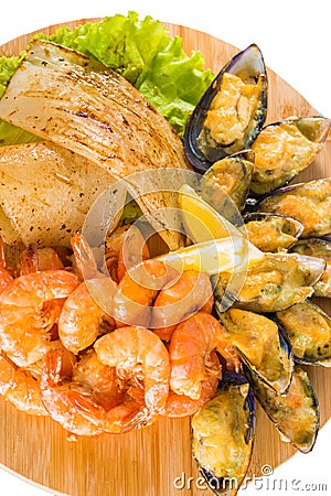 Shrimps, mussels, fish with lemon Stock Photo